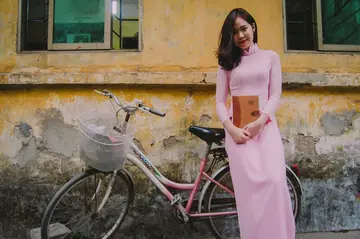 Asian Brunette Poses in a Dress Outdoors