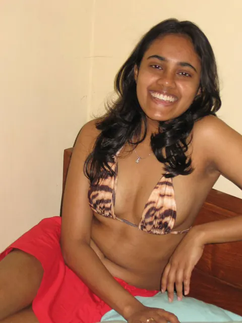 Indian Woman Shows Her Breasts in Lingerie and Skirt on the Bed – photo 1 of 10