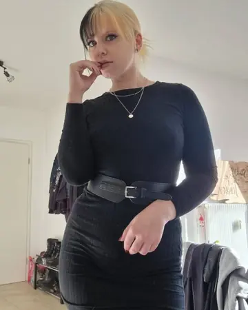 European Blonde Takes Selfies in a Dress Outdoors