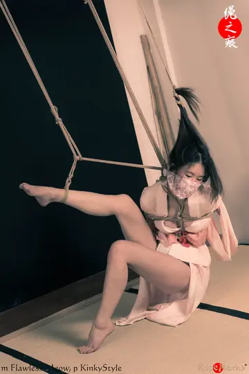 Asian Brunette Restrained by Rope on Limbs and Hair