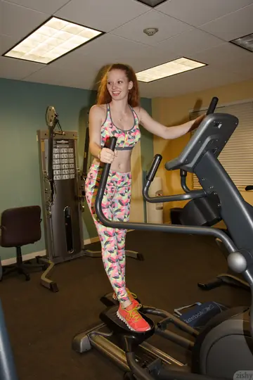 Curly Redhead Reveals Her Nipple in Yoga Pants at the Gym