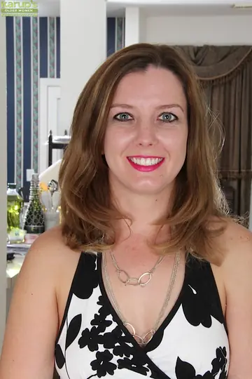 Busty Brunette MILF Strips Out of Her Pantyhose and Spreads Her Muff