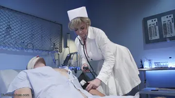 Dee Williams – Thick Blonde MILF Nurse in Bondage Plays with a Strap-On