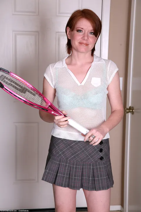 Thick Redhead MILF Strips Out of Her Tennis Skirt to Show Off Her Body – photo 1 of 21