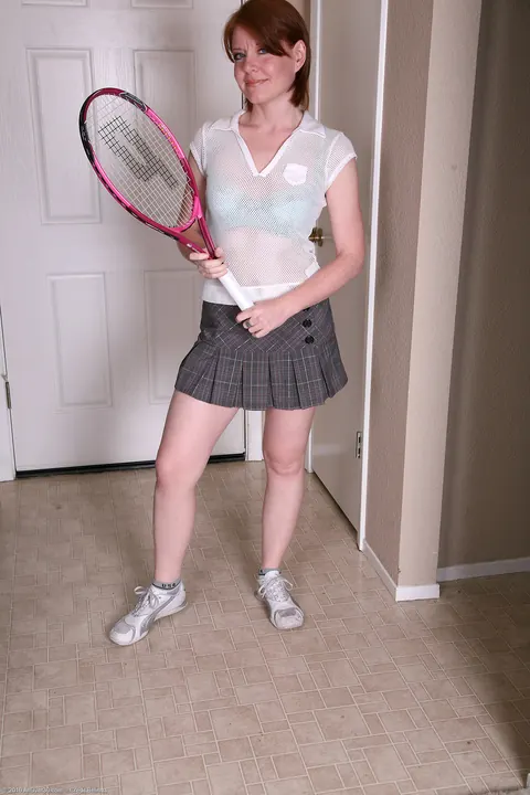 Thick Redhead MILF Strips Out of Her Tennis Skirt to Show Off Her Body – photo 2 of 21