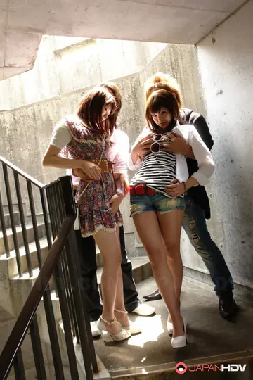 Brunette Asian Women Give Blowjobs and Handjobs on Outdoor Stairs