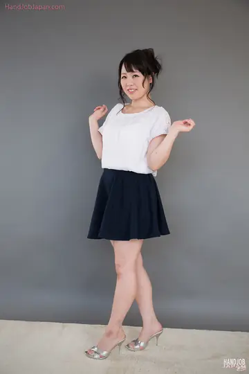 Japanese Brunette in a Skirt Gives a Handjob and Takes Cum on Her Clothes