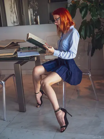 Skinny Redhead Strips Out of Her Skirt and Fingers Her Pussy