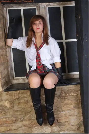 Redhead Exposes Her Ass in Leather Uniform, Boots and High Heels
