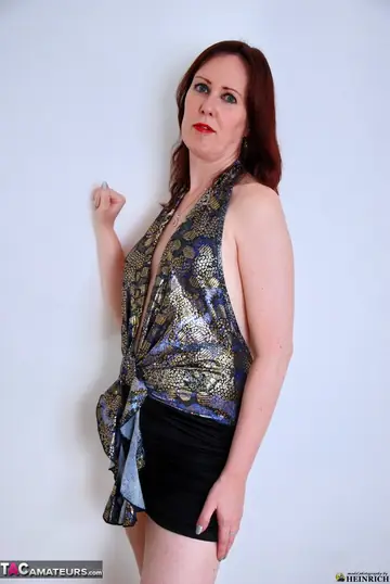European Redhead MILF Strips Out of Her Skirt and Heels