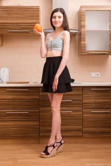 Slender Brunette Bares Her Hairy Bush and Fingers Herself in the Kitchen