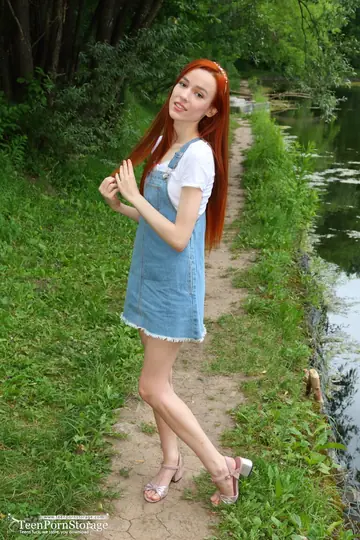 Slim Redhead Lifts Her Skirt and Spreads Outdoors