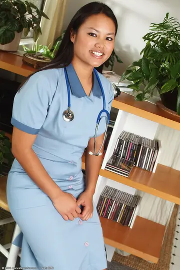 Asian Nurse Strips Out of Her Uniform and Spreads Her Shaved Pussy