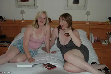 MILF in a Skirt and Heels Sucks and Strokes Two Men in Interracial Threesome