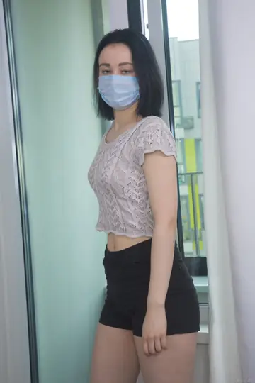 Masked Brunette Strips Out of Her Shorts and Toys Her Pussy with a Dildo