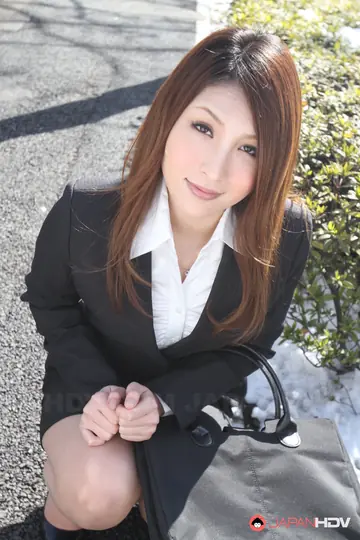 Japanese Redhead in a Suit Poses Outdoors