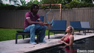 Short-Haired Blonde Takes Interracial Anal by the Pool