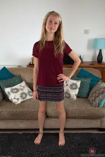 Slim Hairy Blonde Babe Spreads Her Pussy on the Sofa