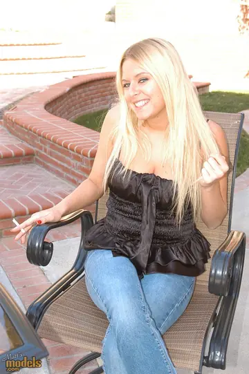 Riley Evans – Busty Blonde Smokes in a Bikini and Skirt Outdoors