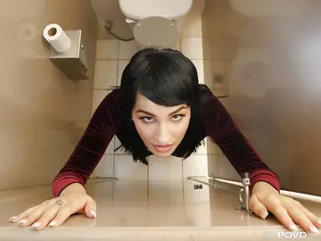 Allora Ashlyn – Slim Brunette in High Heels Fingers Her Shaved Pussy in the Bathroom