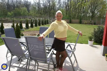 Mature Blonde MILF with Big Tits Uses a Dildo on the Sofa