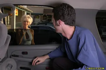 Busty Blonde MILF Gives a Blowjob in the Car
