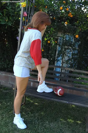 Mikela Kennedy – Mature Blonde in Shorts Undresses Outdoors