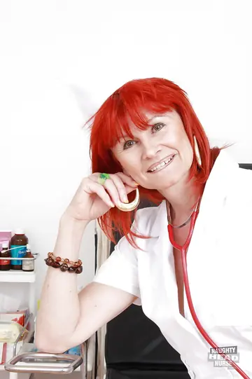 Amanda Rose – Busty Mature Redhead Nurse in Stockings Toys Her Pussy