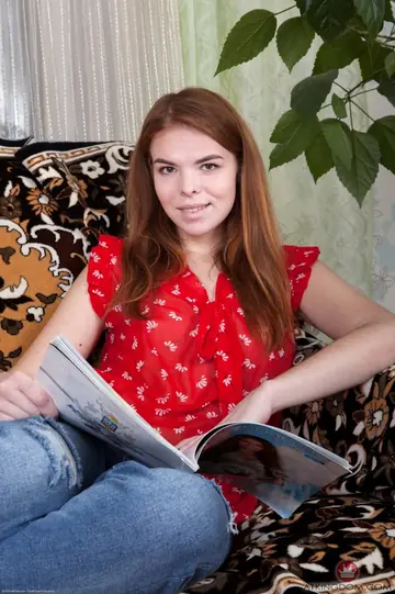 Ukrainian Redhead Peels Off Her Jeans and Spreads Her Hairy Pussy on the Sofa