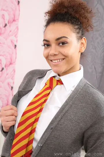 Ebony Woman with Short Hair Strips Out of Her Uniform to Show Her Big Tits