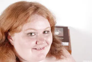 Mature BBW with Big Tits and Piercings Poses Nude
