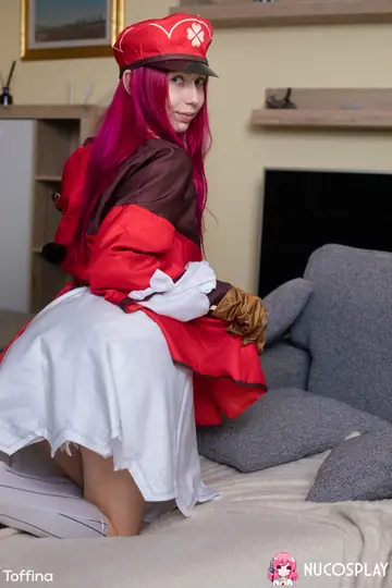 Woman in Cosplay Spreads Her Shaved Pussy and Uses a Dildo