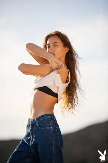 Taya Vais – Slim Busty Brunette Strips Out of Her Jeans on the Beach