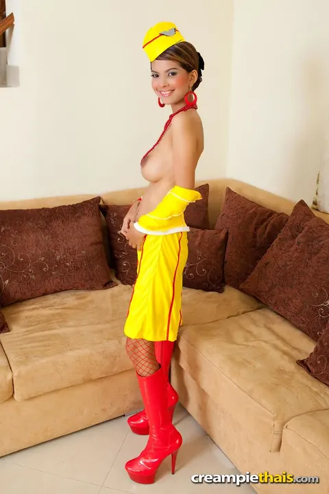 Slim Thai Babe Flaunts Her Big Tits in Fishnet Uniform and Heels – photo 10 of 20