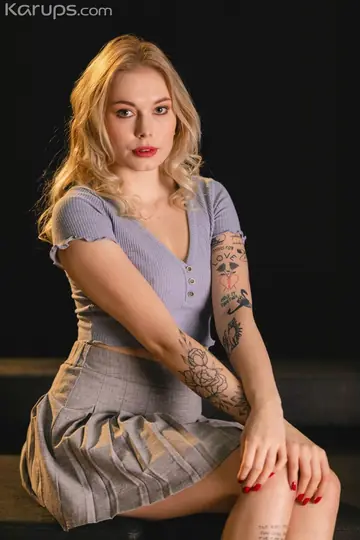Mimi Cica – European Blonde Shows Off Her Tattoos and Piercings Clothed