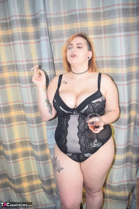 Redhead MILF Smokes and Drinks in Lingerie Before Stripping – photo 7 of 16