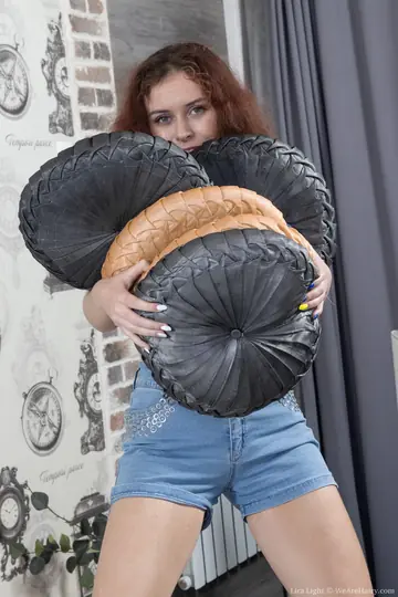 Lira Light – Redhead Undresses and Rubs Her Hairy Pussy