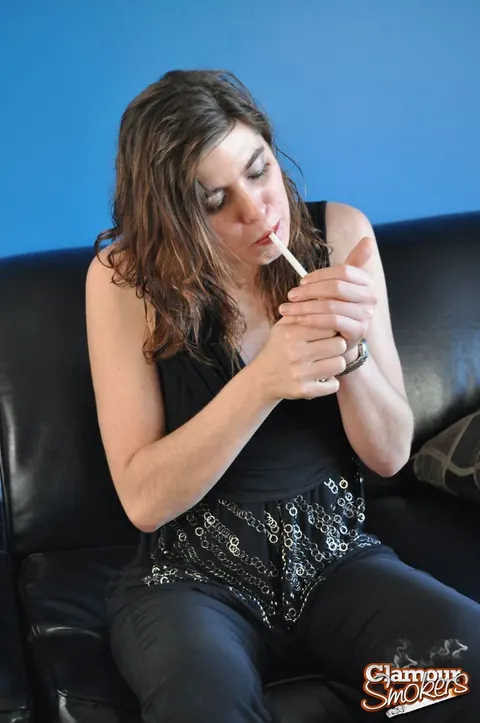 Woman Strips to Panties While Smoking a Cigarette – photo 2 of 15