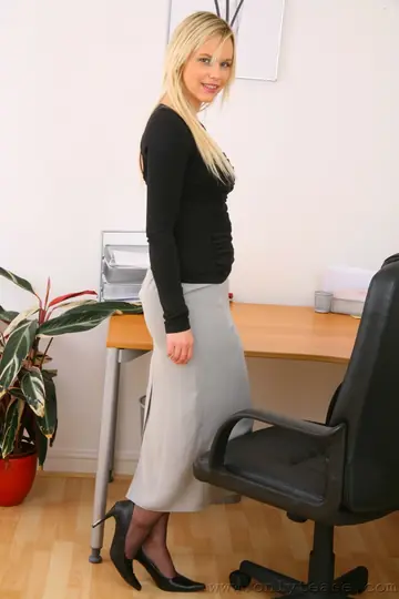 Kayla Fox – Busty British Blonde Poses in a Skirt and Stockings at the Office