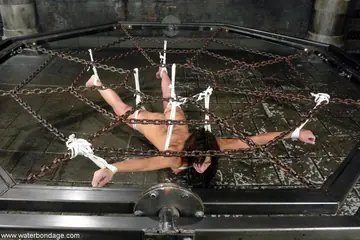 Gina Caruso – Tattooed Brunette in Bondage Spreads Her Pussy
