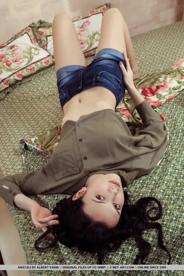 European Brunette Strips Out of Her Shorts and Spreads on the Bed