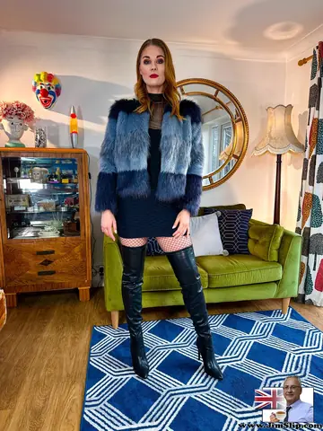 Redhead Strips Out of Her Leather Skirt and Stockings