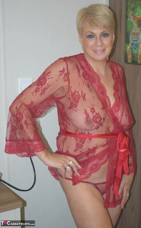 Mature Blonde Opens Her Latex Robe to Show Her Big Saggy Tits – photo 2 of 16