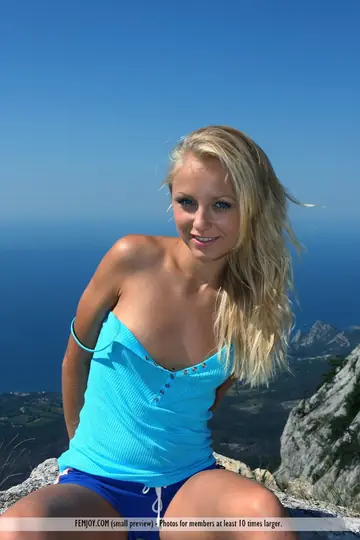 Blonde European Spreads Her Hairy Pussy on a Cliff in Shorts