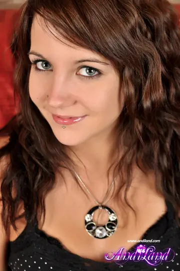 Slim Brunette Undresses Out of Her Jeans and Sneakers in the Bedroom