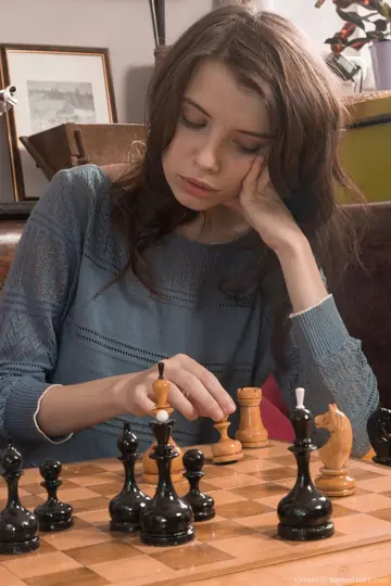 Slim Brunette Bares Her Hairy Pussy After Strip Chess Loss