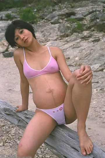 Pregnant Japanese Woman Strips Off Her Bikini on the Beach