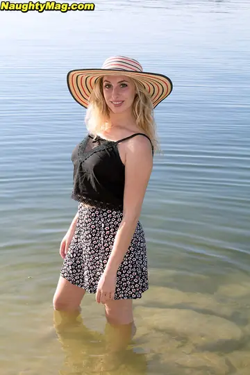 Busty Woman Undresses and Spreads on the Nudist Beach