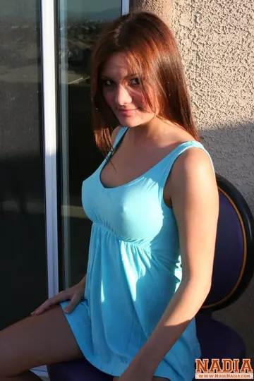 Redhead with Big Enhanced Tits Spreads on the Balcony