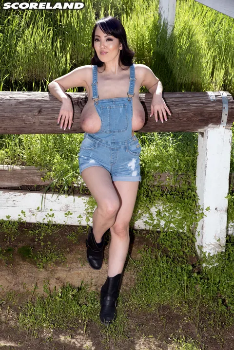 Hitomi Tanaka: Busty Asian Woman Bares Her Natural Tits at a Horse Farm – photo 7 of 16